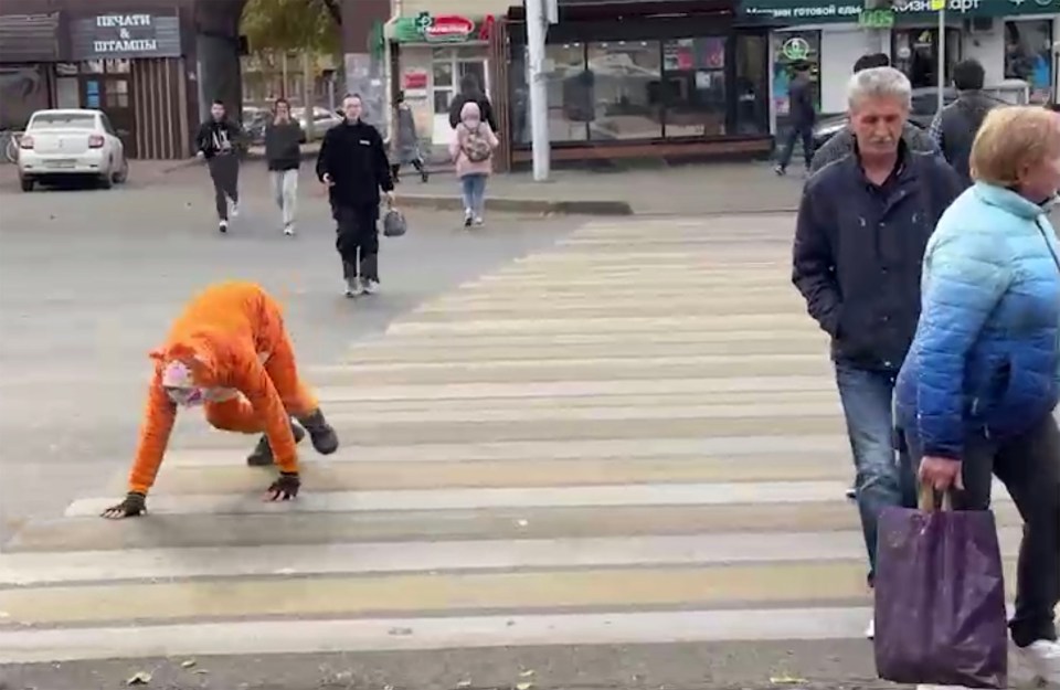 Another teenager dressed up in an animal costume was seen crossing a road in Russia