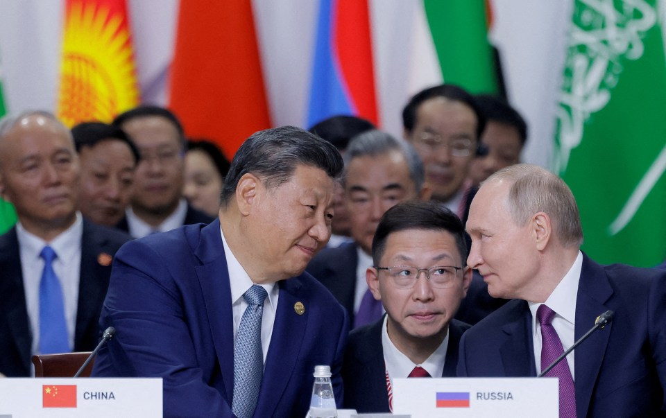 Russian President Vladimir Putin (right) has lent on Musk for a favour for pal Xi Jinping (left)