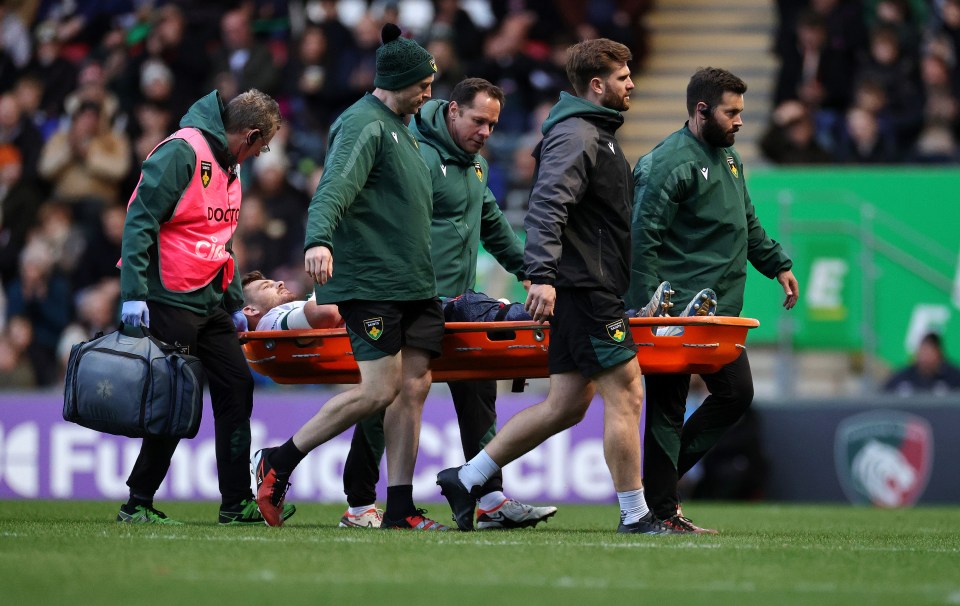 a man on a stretcher with the word jaguars on it