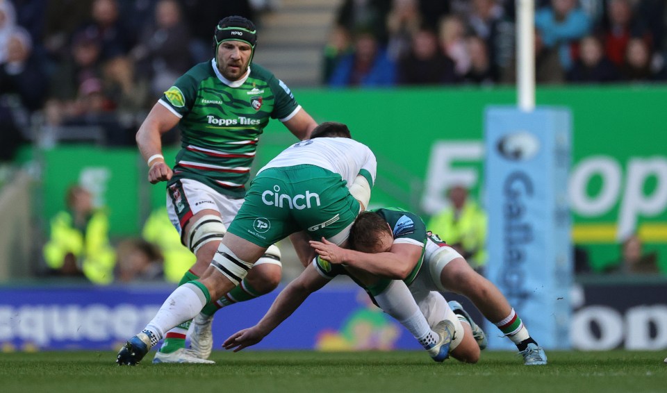 a rugby player with cinch on the back of his shorts