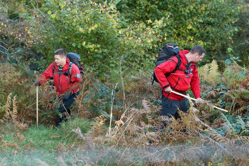 a man in a red jacket with the word rescue on it