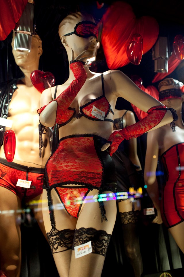 a mannequin wearing a red lingerie set with a tag that says ' lingerie ' on it