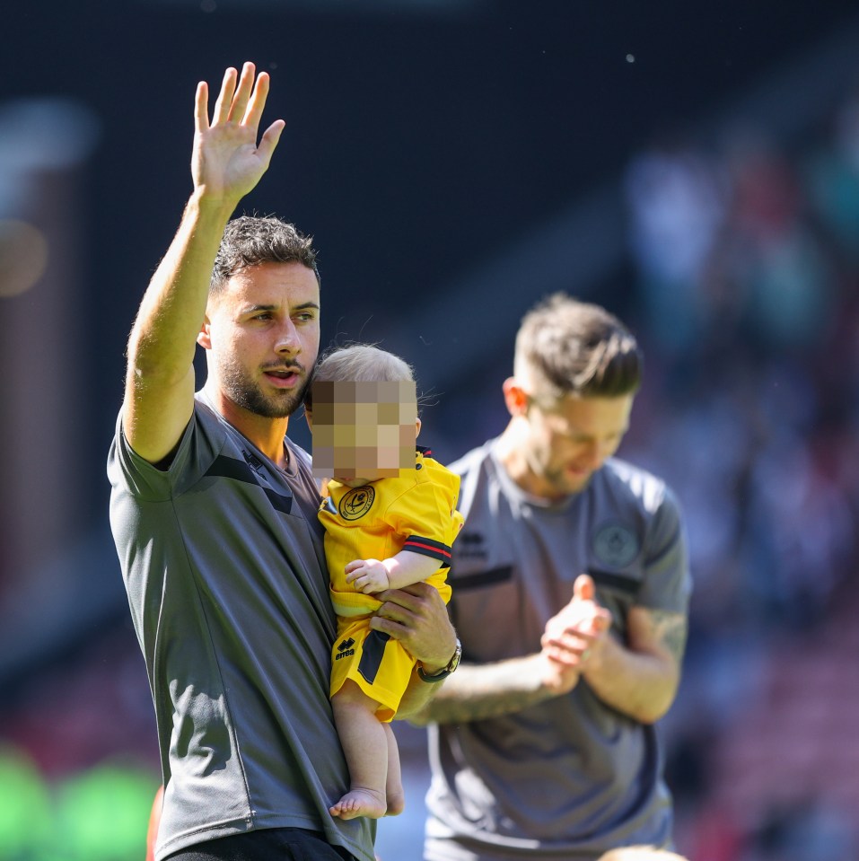 George Baldock waves to fans at Bramall Lane on May 19, 2024