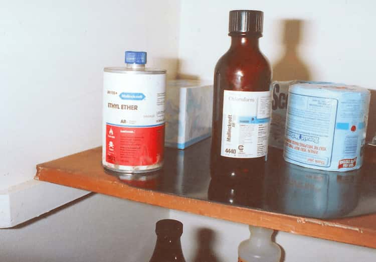 a bottle of ethyl ether sits on a shelf