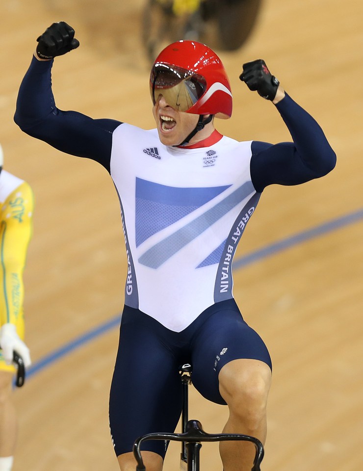 a man wearing a great britain uniform is riding a bike