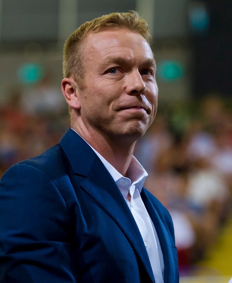 a man in a blue suit and white shirt looks to the side