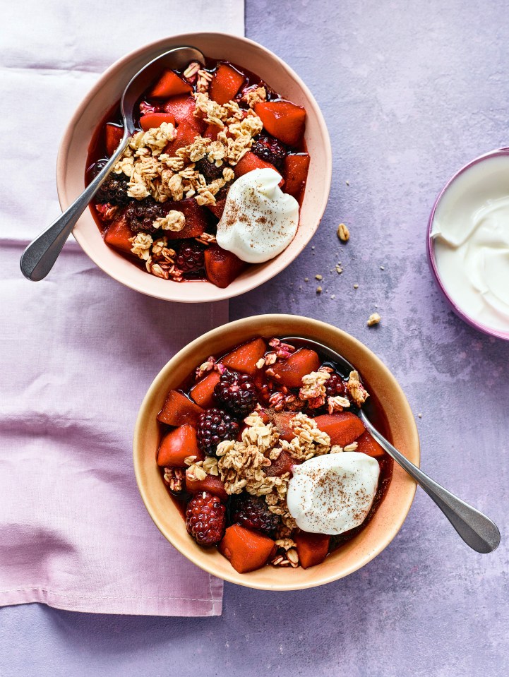 two bowls of fruit with granola and whipped cream on top