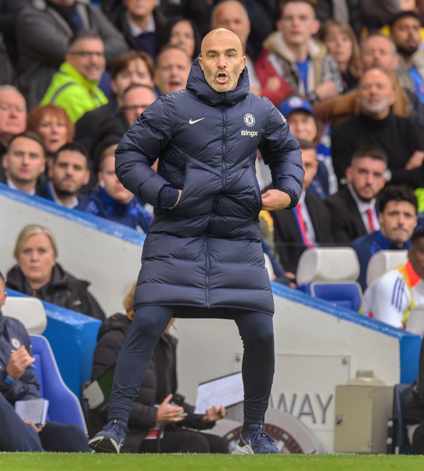 a man wearing a jacket that says ' chelsea ' on it