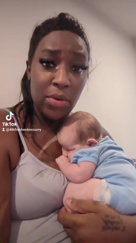 a woman is holding a baby in her arms with a tiktok watermark