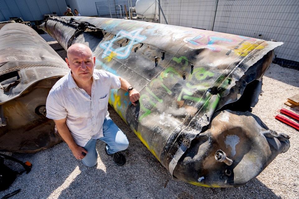 The Sun's Foreign Editor Nick Parker with the Iranian missile that came down in the Negev Desert, Israel