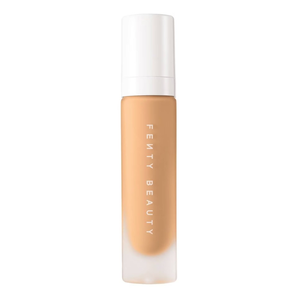 a bottle of fenty beauty foundation on a white background