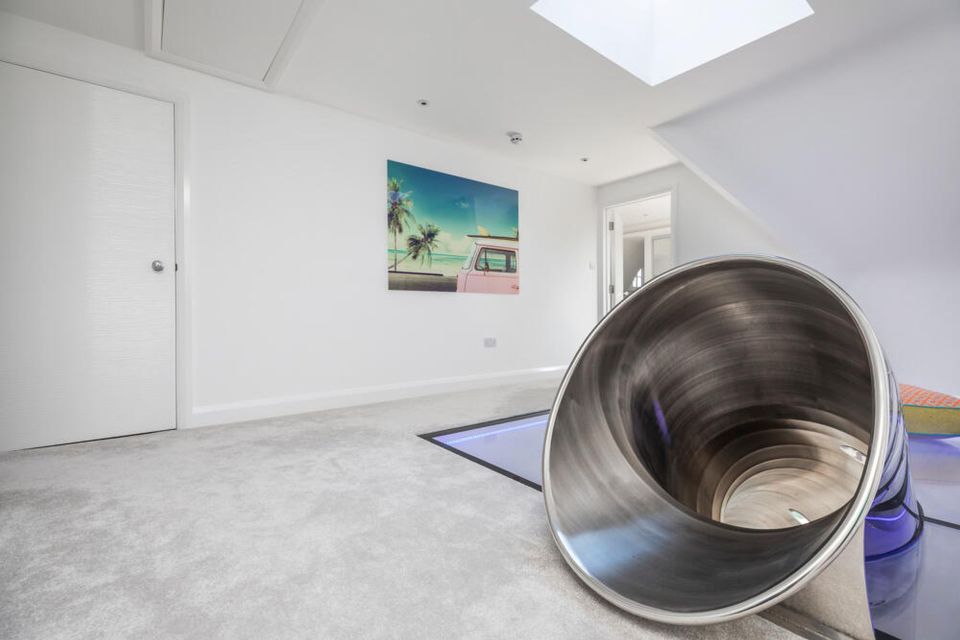 Estate agents Spencers say the house has a 'sense of fun' thanks to the slide