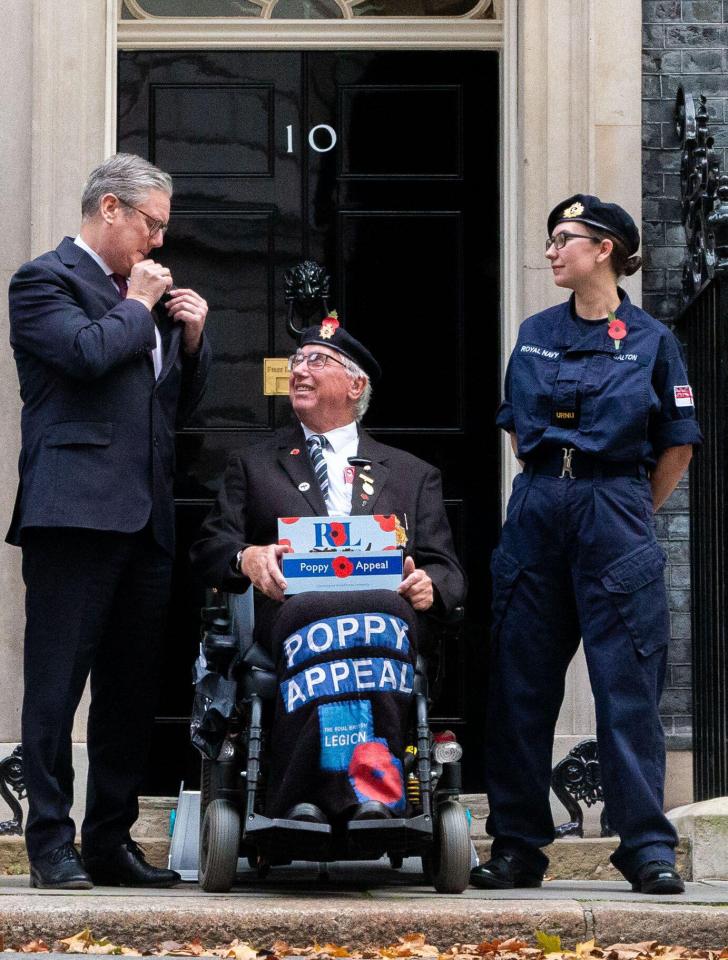 The PM with paramedic student Zoe Salton and National Service veteran Michael Homer