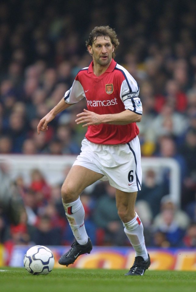 a soccer player wearing a red and white jersey that says dreamcast