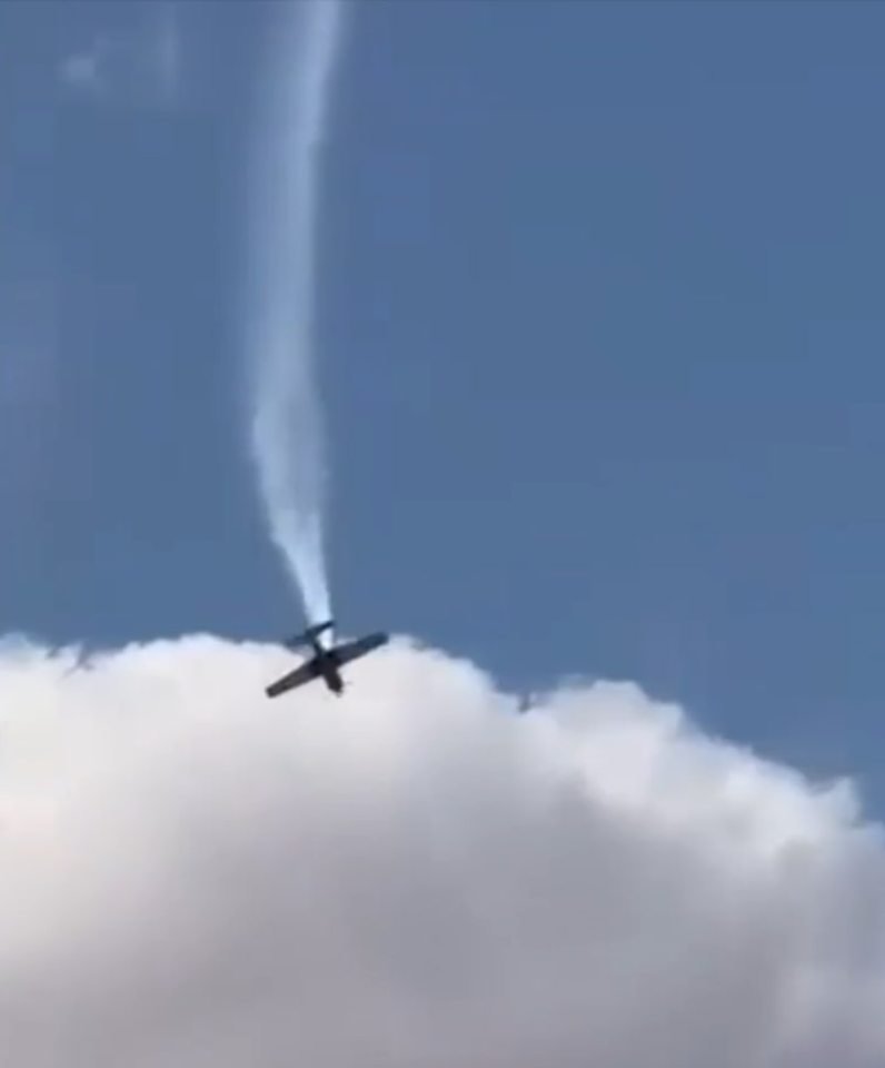 The plane appears to fall to the ground after trying to do multiple flips