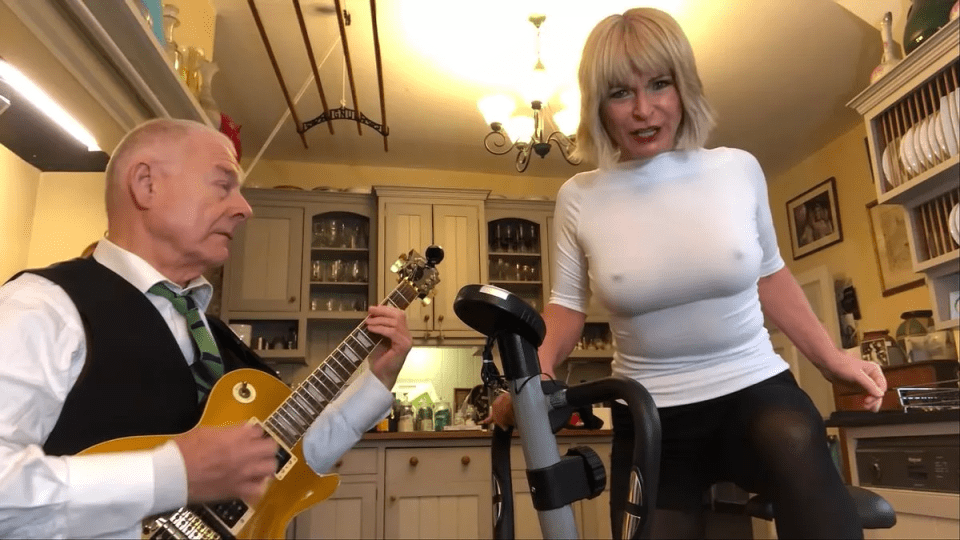 The singer performing in a tight top on a live stream alongside guitarist husband Robert Fripp