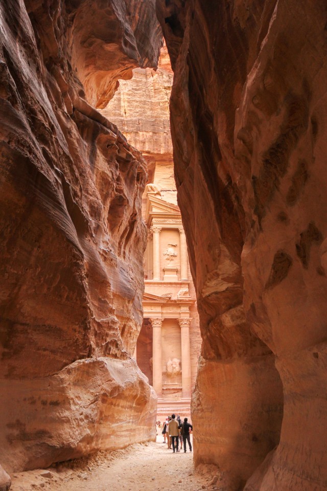 The Treasury cliff temple viewed from the Siq gorge entrance, Petra, Jordan