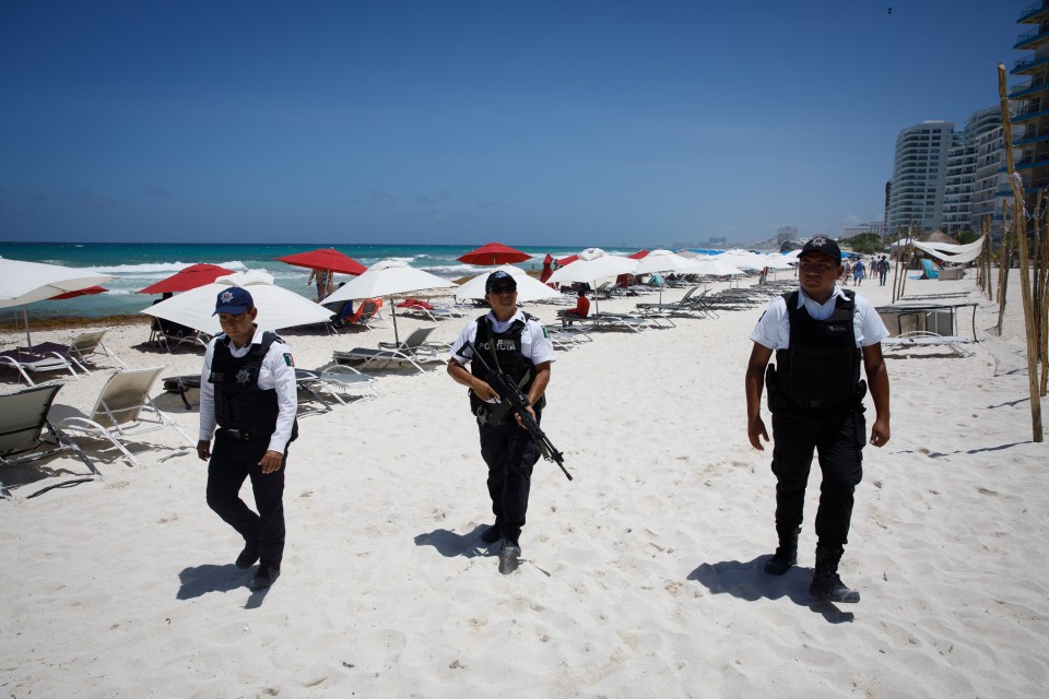 Heavily-armed cops patrol the beaches of Cancun to tackle the staggering murder rate