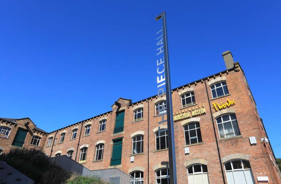 a brick building with a sign that says piece hall