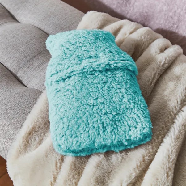 According to shoppers, this mini hot water bottle will keep you "nice and toasty"