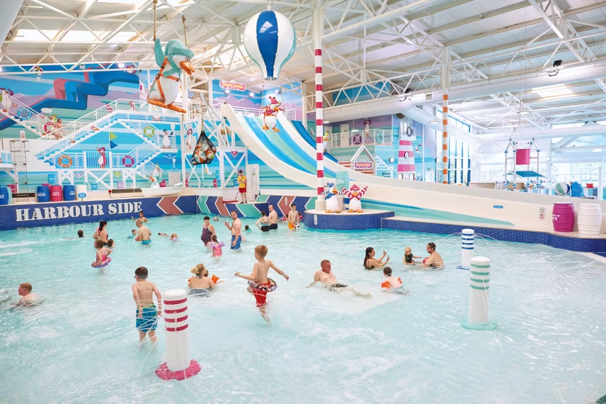 children are playing in a harbour side water park