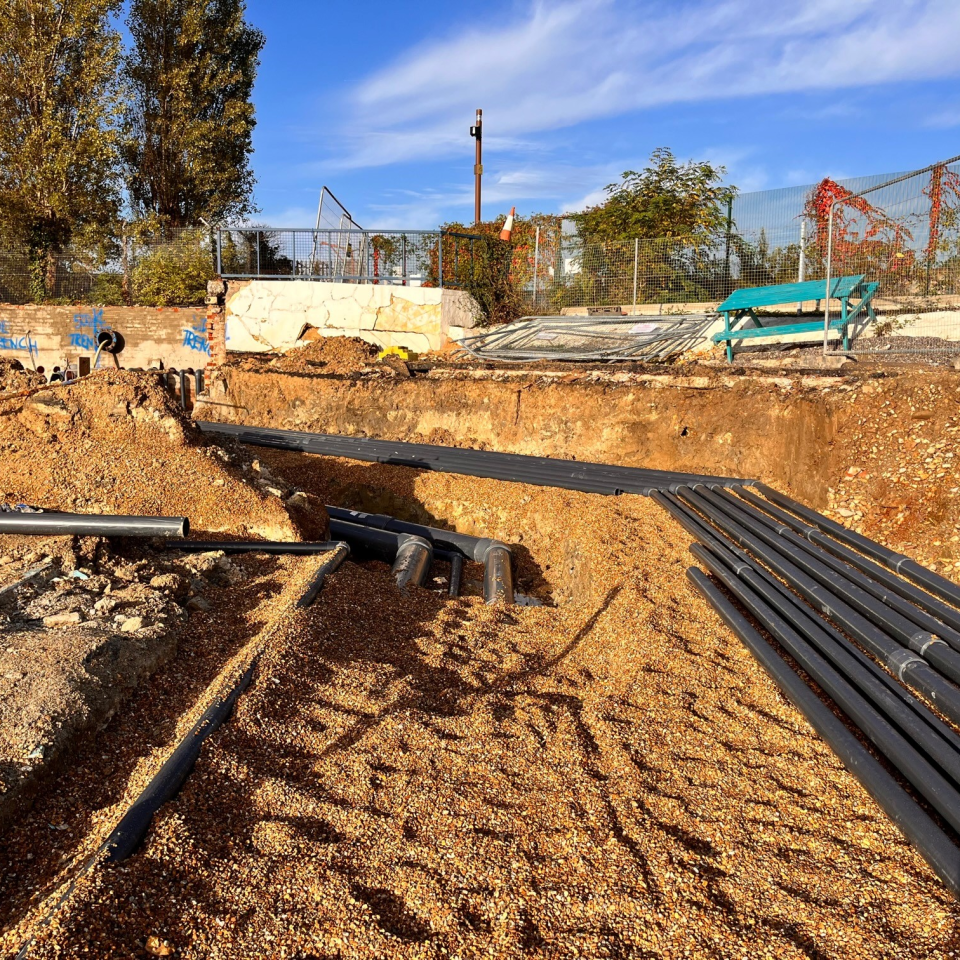 Pipework has yet to be laid underground to connect the pool, plant room and water tank