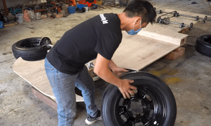 The pint-sized Roller has a motor inside and uses real car wheels