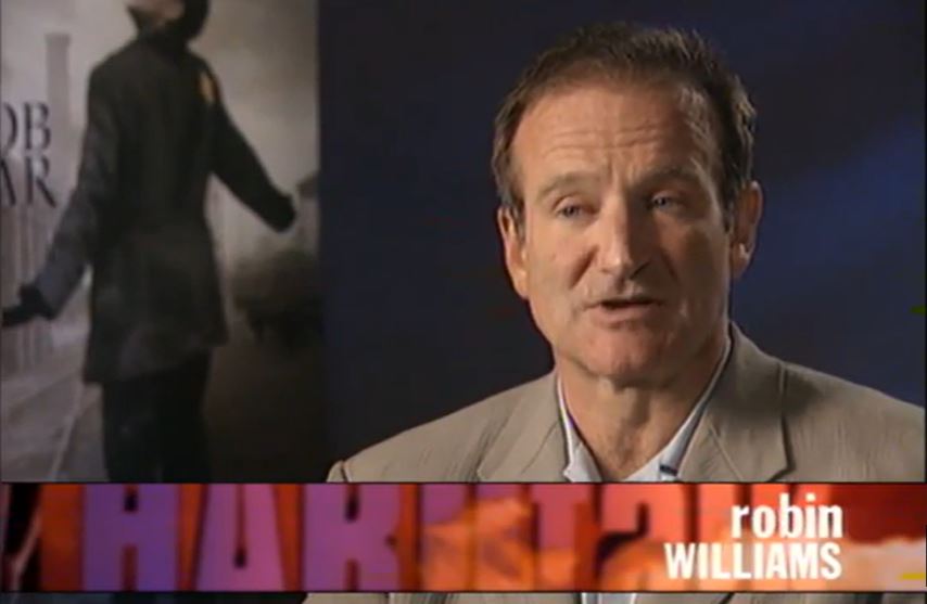 robin williams is featured on a television screen