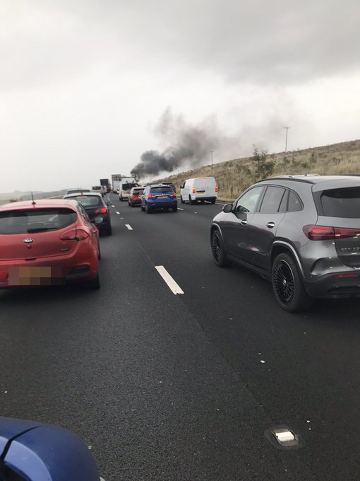 a mercedes benz suv is driving down a highway