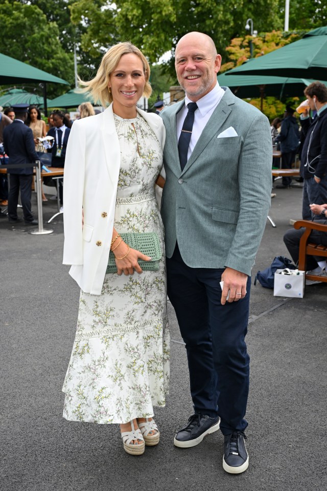 a man and a woman pose for a picture together