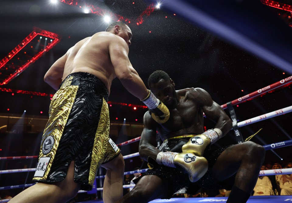 two boxers are fighting in a ring with a banner that says ' o'reilly ' on it