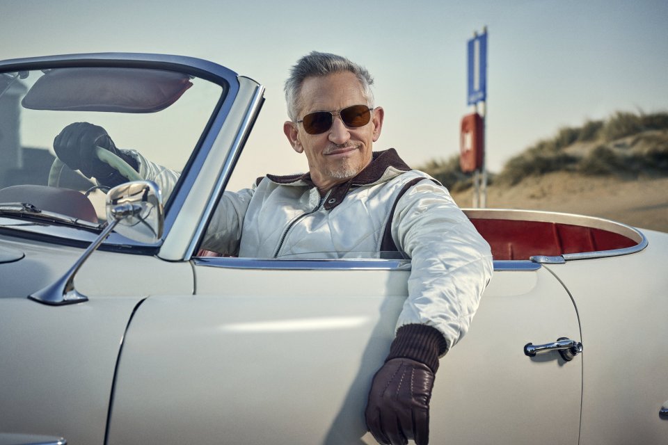 a man wearing sunglasses is sitting in a white car