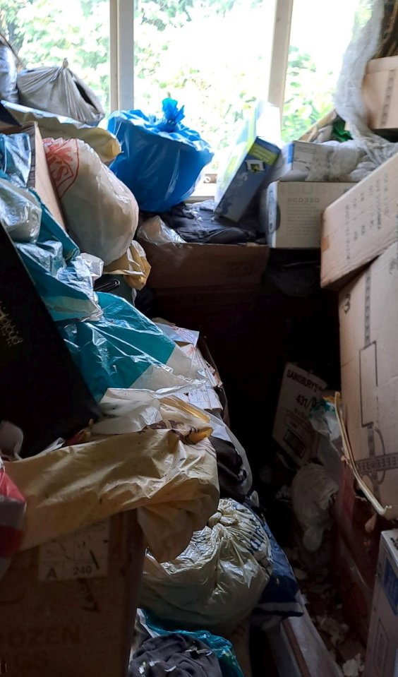 Rubbish was piled so high it reached the windows