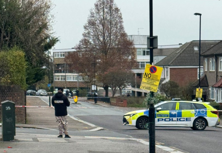 A man has been shot dead on a quiet residential street and two others rushed to hospital