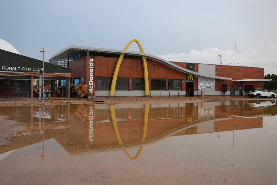 Floodwater stands in front of a McDonald’s after flooding