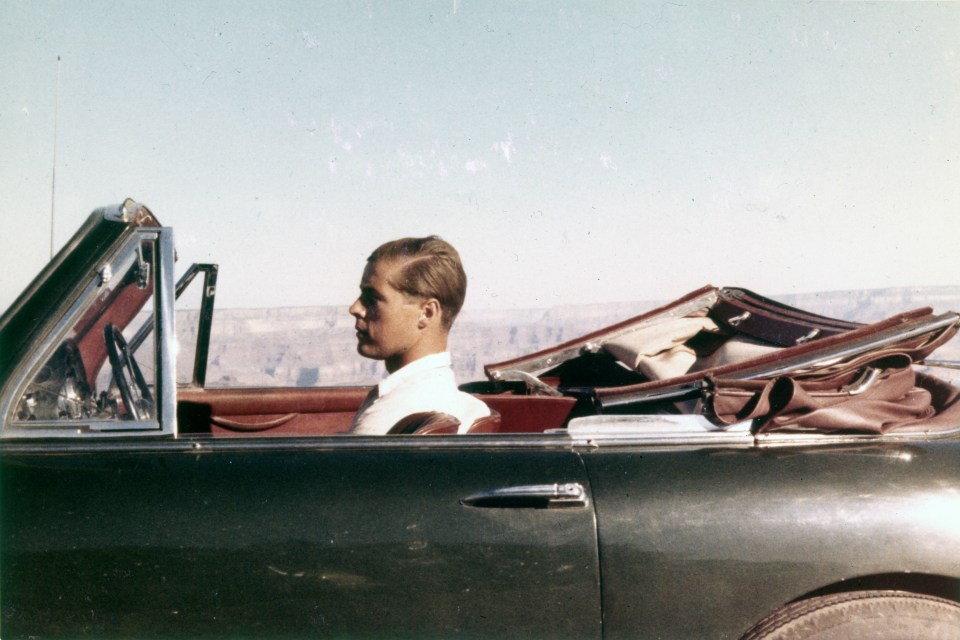 Lucan in his open top Aston Martin