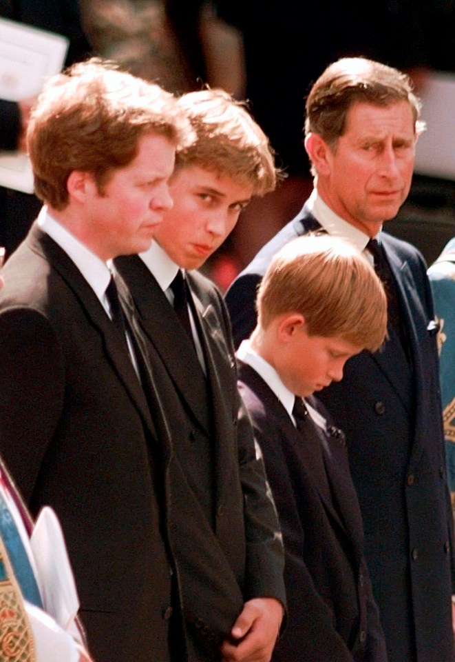 Prince William watches the hearse pull away from Westminster Abbey carrying the body of his mother Princess Diana