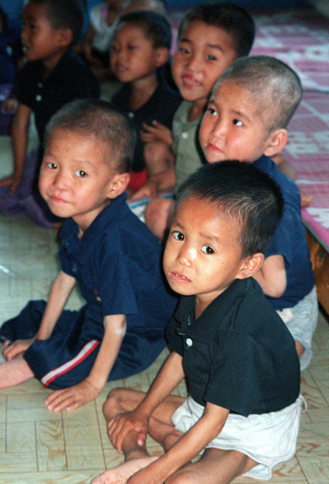 Malnourished children sit in the Chong Cheng nursery, in Huichon, North Korea, 1997