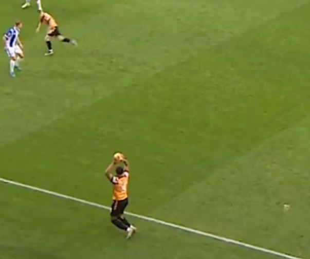 a group of soccer players are playing on a field