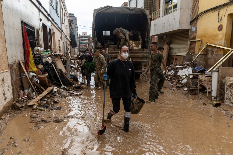 Experts are urging volunteers to wear face masks and gloves as the stagnant flood water could carry diseases