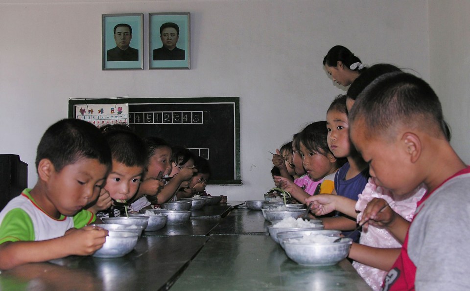 North Korean children eat lunch at a government run kindergarten in 2005