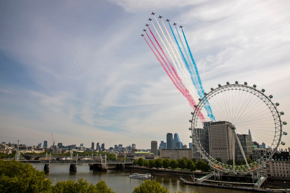 The Red Arrows fly over The London Eye for the Victory Day 75 celebrations in London