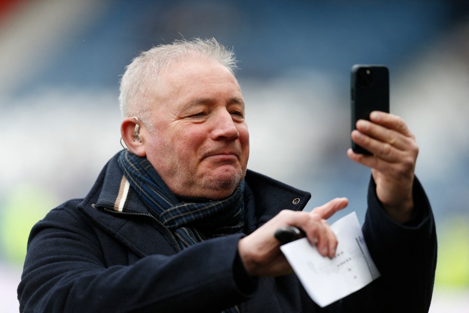 a man taking a picture of himself with a cell phone