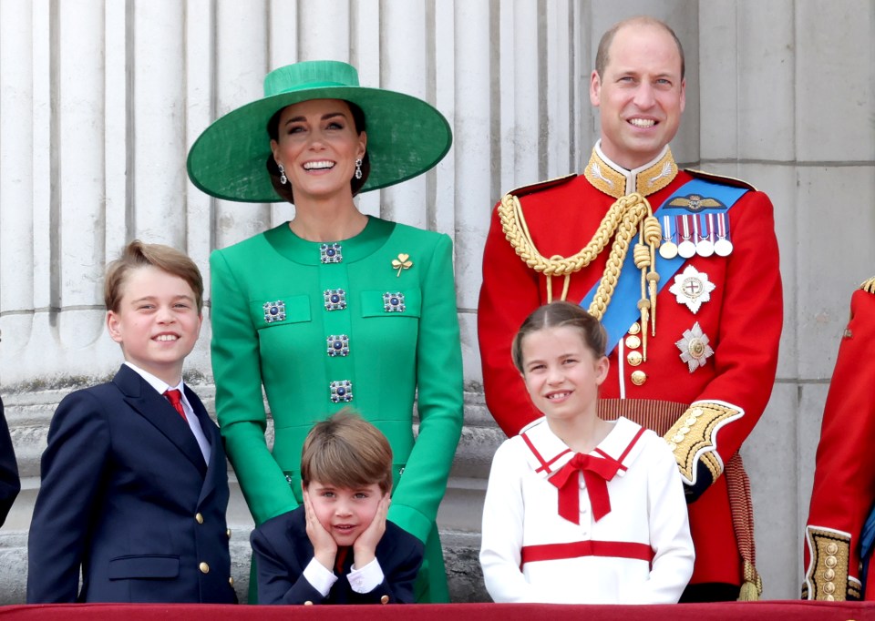 a group of people posing for a picture with one wearing a green hat