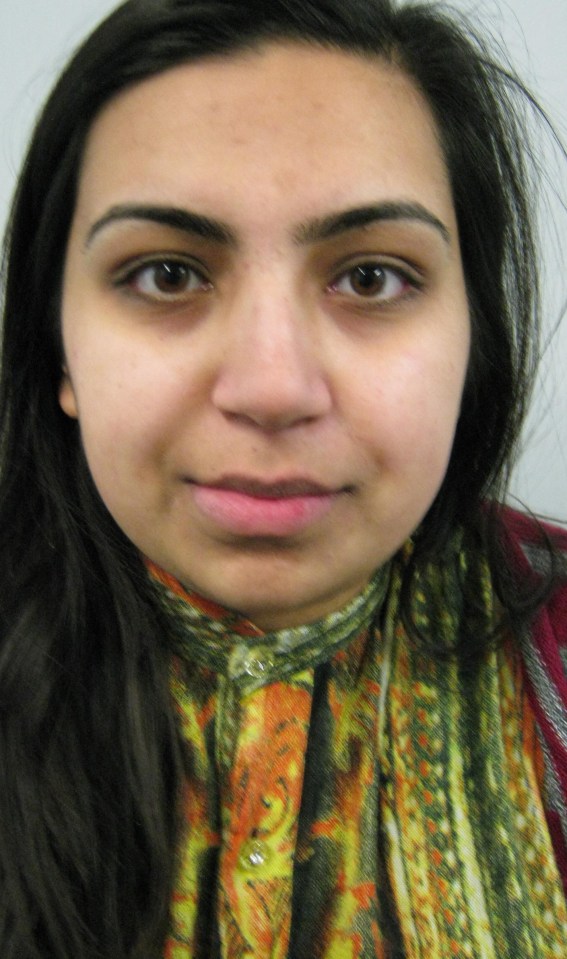 a close up of a woman 's face with a scarf around her neck