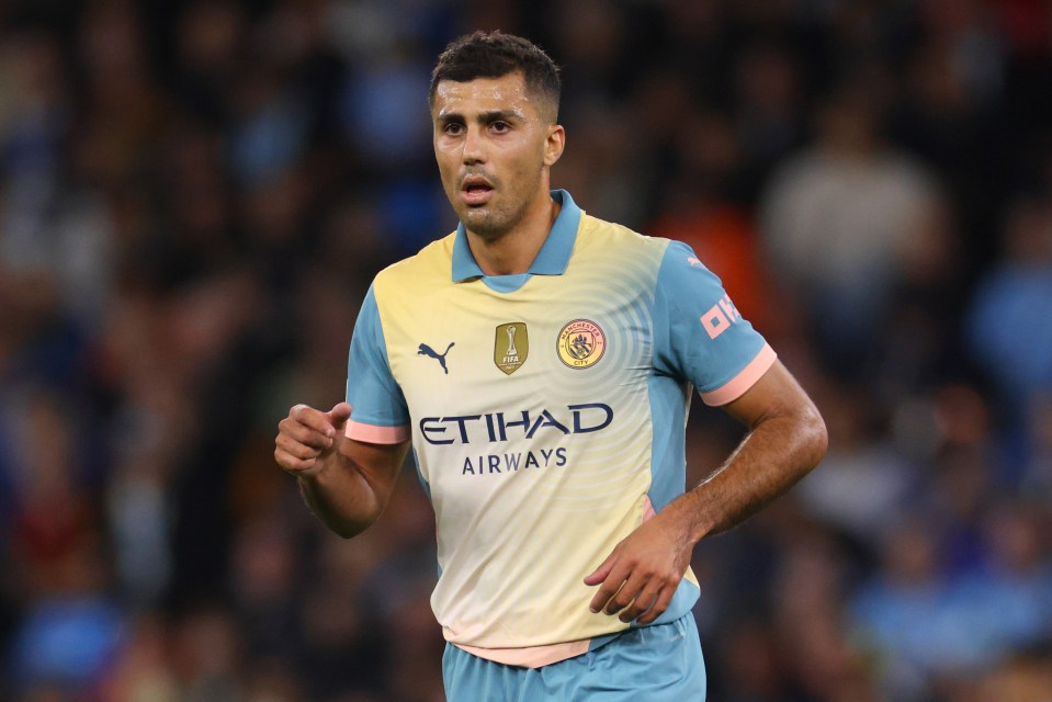 a soccer player wearing a blue and yellow jersey that says etihad airways