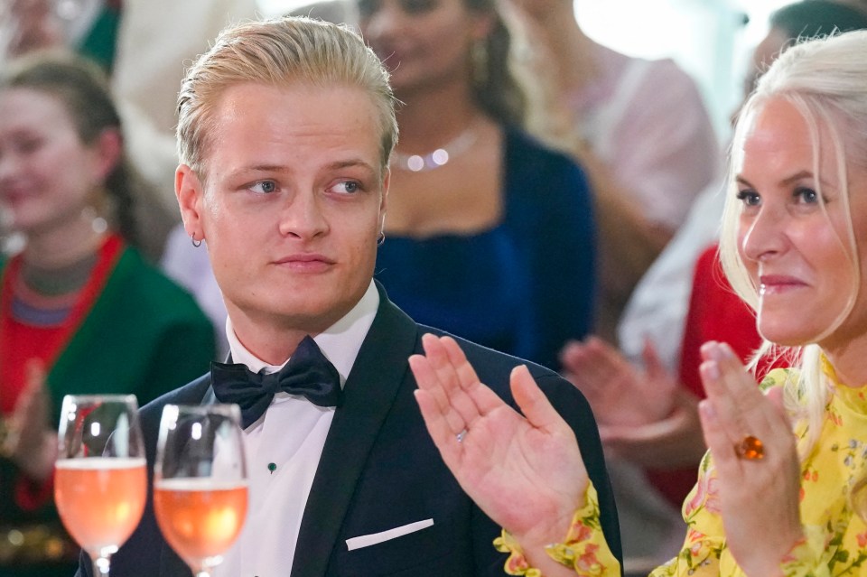 Marius Borg Høiby sitting next to his mother Norwegian Crown Princess Mette-Marit