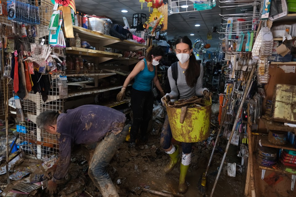 Teams and civilians try to clean the streets, shops and public places