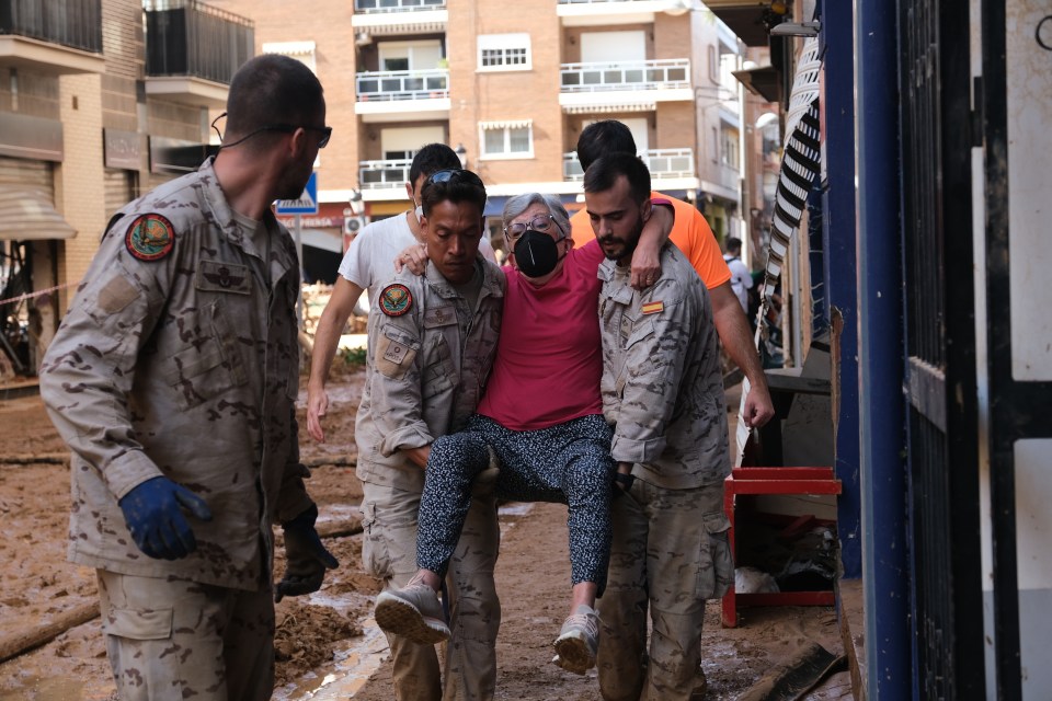 Teams and civilians try to clean the streets, shops and public places as search and rescue efforts and aid distribution continue