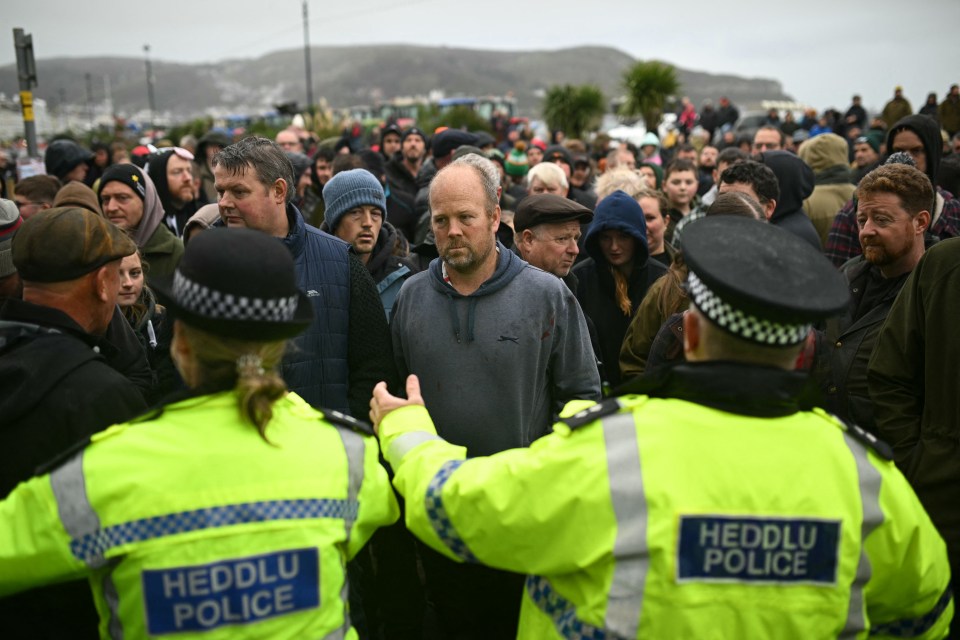 Farmers gather on the Promenade, outside the venue of the Welsh Labour Party conference